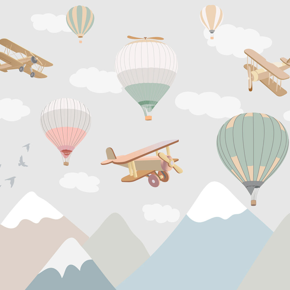 Montañas con aviones y globos aerostáticos